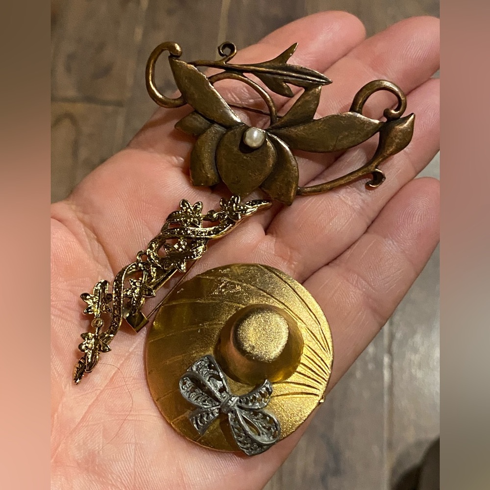 3 older  brooches.